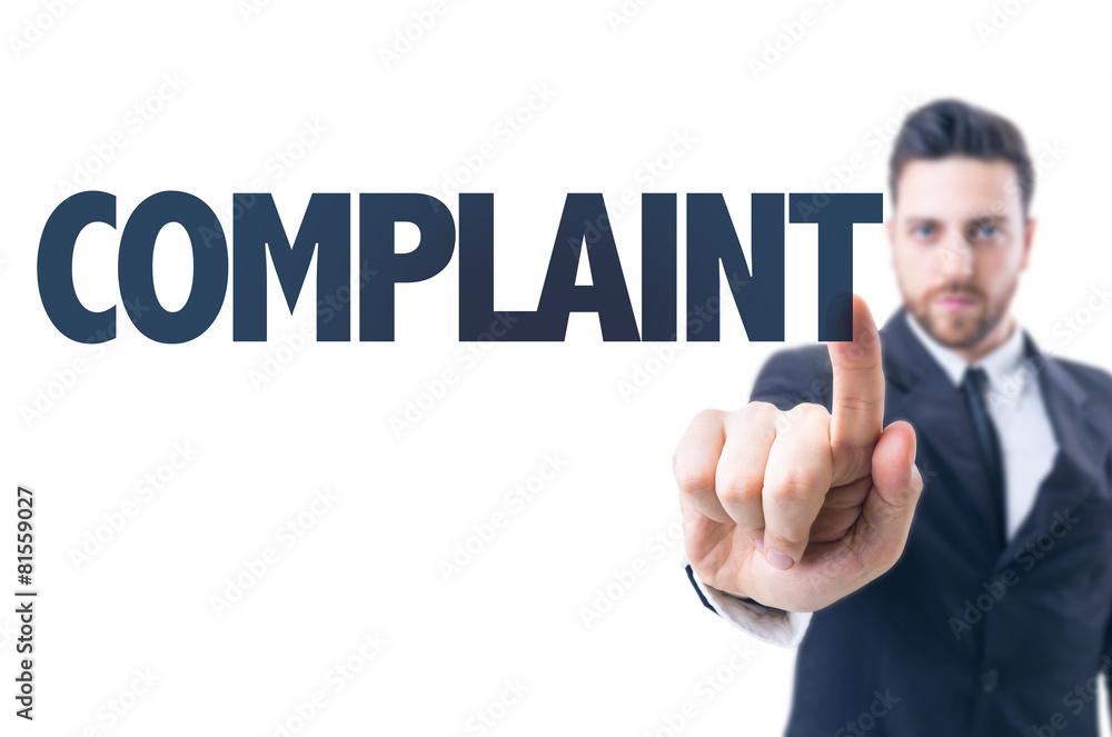 Business man pointing the text: Complaint Business man pointing the text: Complaint