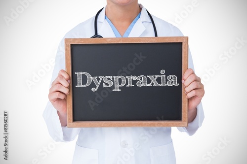 Dyspraxia against doctor showing little blackboard photo