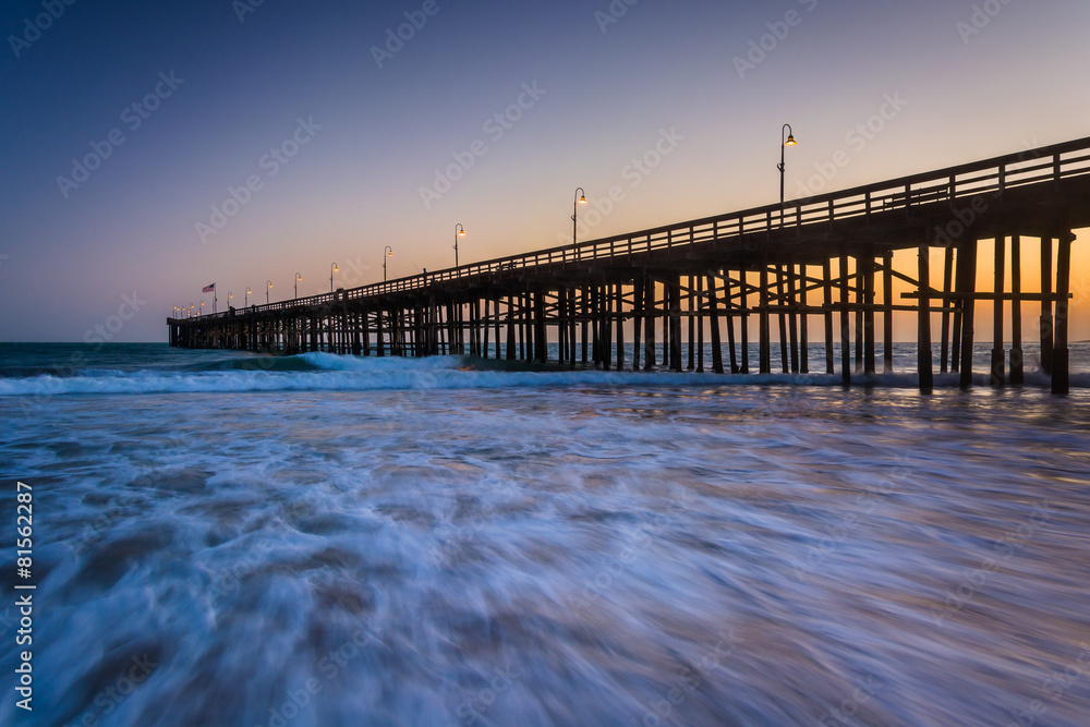Waves in the Pacific Ocean and the pier at sunset, in Ventura, C