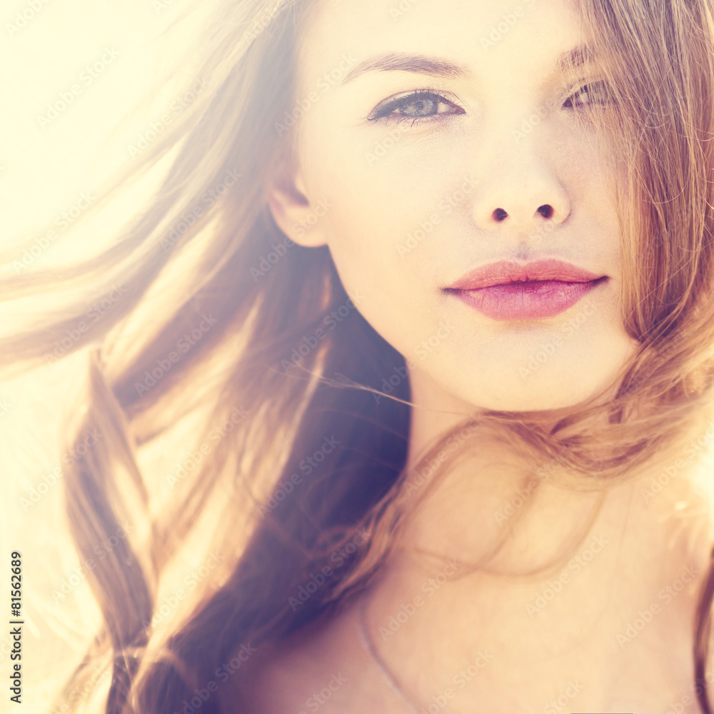 face of beautiful young smiling girl in a sunny day face of beautiful young smiling girl in a sunny day