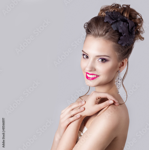 girl with a gentle evening hairstyles with flowers in their hair