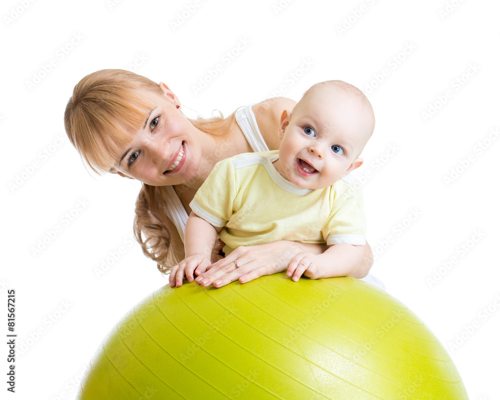 mother and her baby having fun with gymnastic ball mother and her baby having fun with gymnastic ball