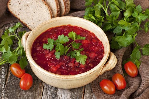 Borscht, beetroot soup with bread and parslay photo