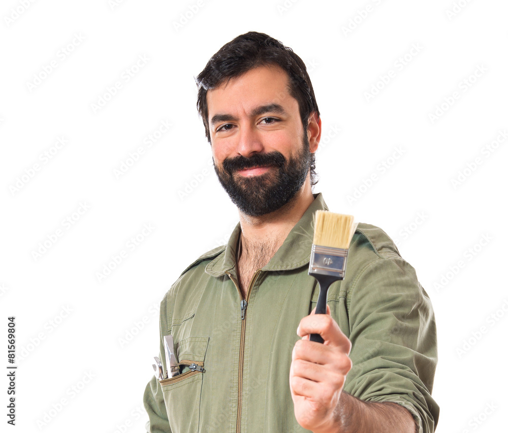 mechanic holding a brush