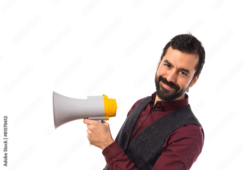 Man wearing waistcoat shouting by megaphone Man wearing waistcoat shouting by megaphone