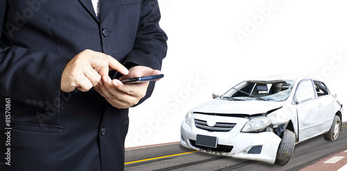man using phone after accident, insurance concept