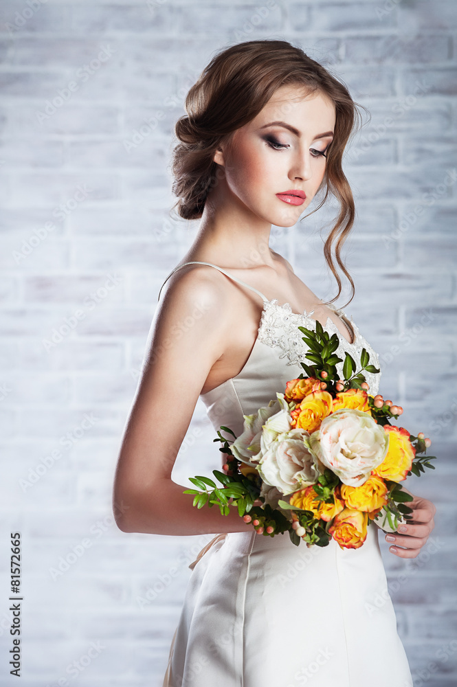 Beautiful woman with a wedding bouquet