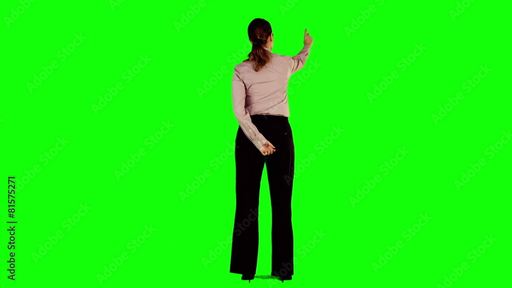 Businesswoman interacting with green screen Businesswoman interacting with green screen