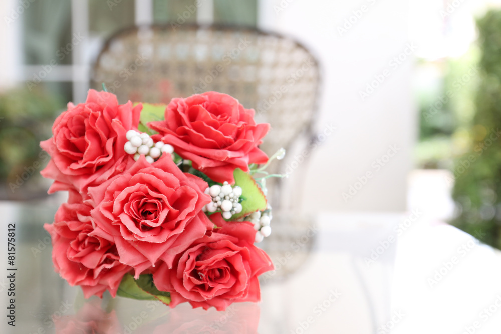Beautiful roses in a ceramic vase on a table. Beautiful roses in a ceramic vase on a table.