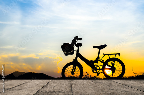 Bicycle silhouette with sun set.
