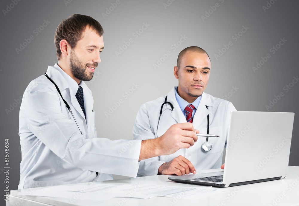 Doctor. Doctors working on a laptop Doctor. Doctors working on a laptop