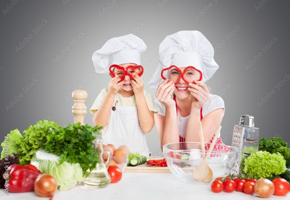 Kid. Mother and kid cooking and having fun in kitchen Kid. Mother and kid cooking and having fun in kitchen