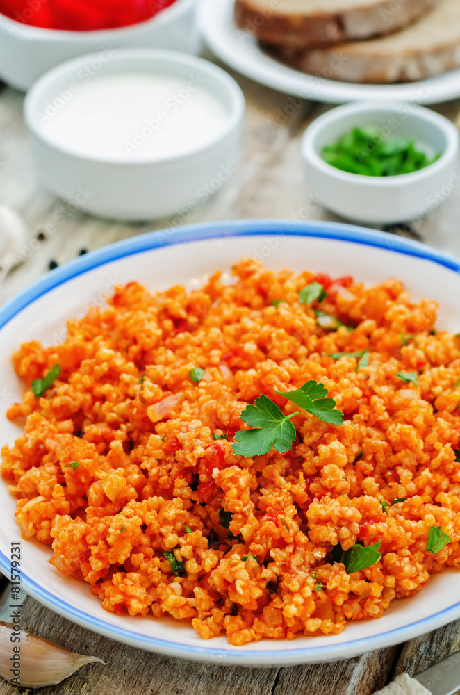millet porridge with tomato sauce, garlic and parsley millet porridge with tomato sauce, garlic and parsley