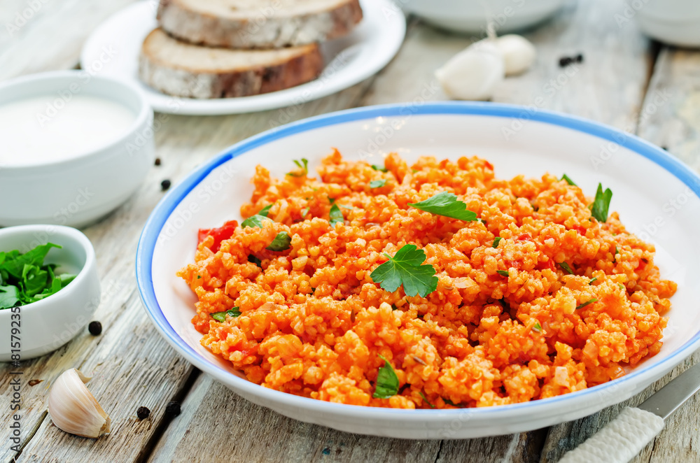 millet porridge with tomato sauce, garlic and parsley millet porridge with tomato sauce, garlic and parsley