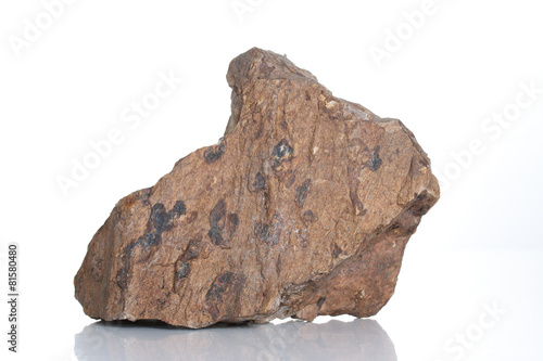 Fragment of granite , isolated on white background