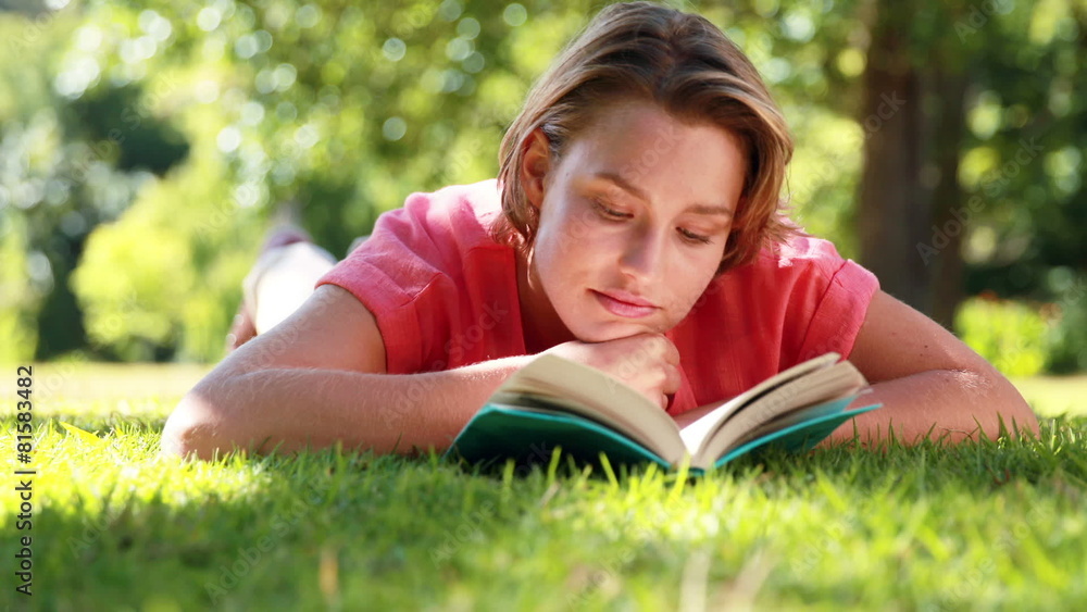 Pretty woman reading book in the park Pretty woman reading book in the park
