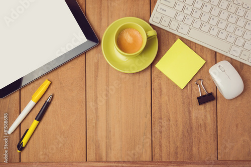 Business background with tablet, keyboard and coffee photo