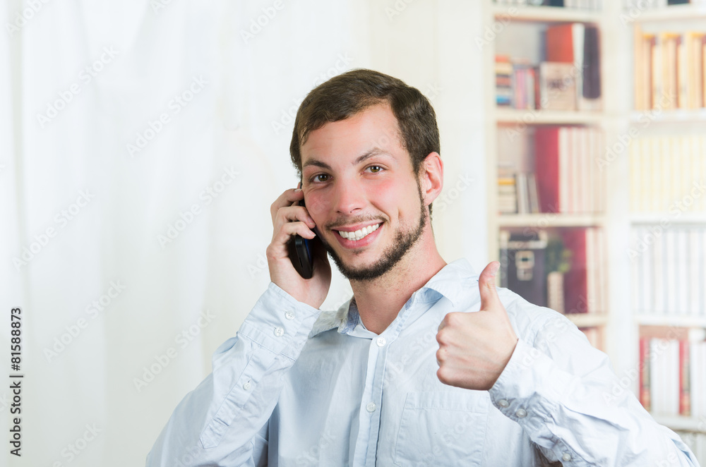 young handsome man using cell phone young handsome man using cell phone