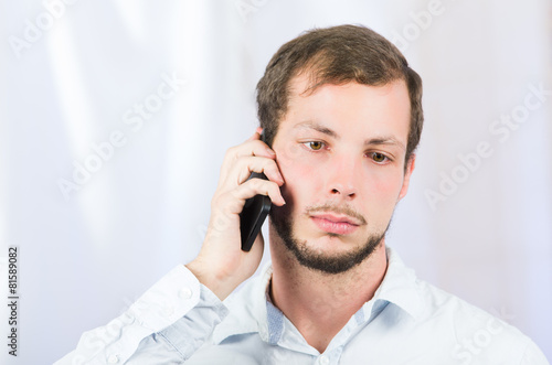 young handsome man using cell phone