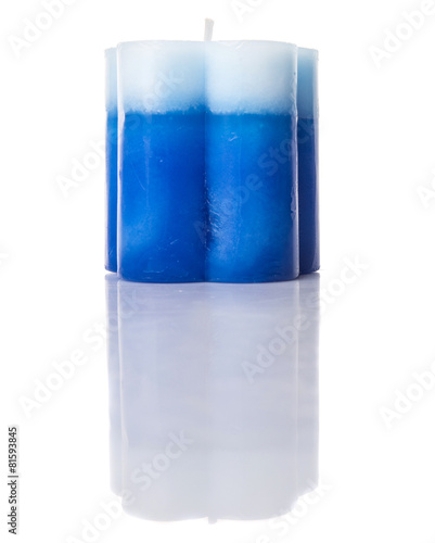 Blue colored aromatic candle over white background