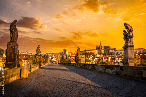 Leinwand Poster Charles bridge and Prague castleon sunrise