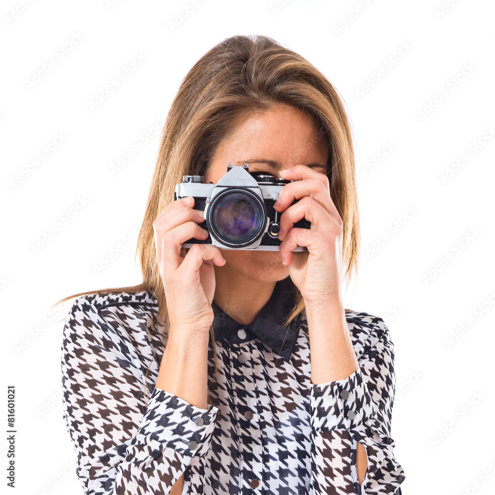 Woman photographing over white background Woman photographing over white background