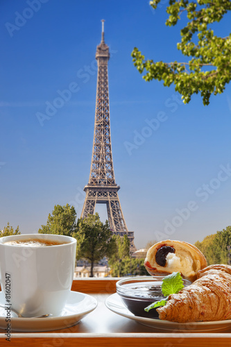 Coffee with croissants against Eiffel Tower in Paris, France