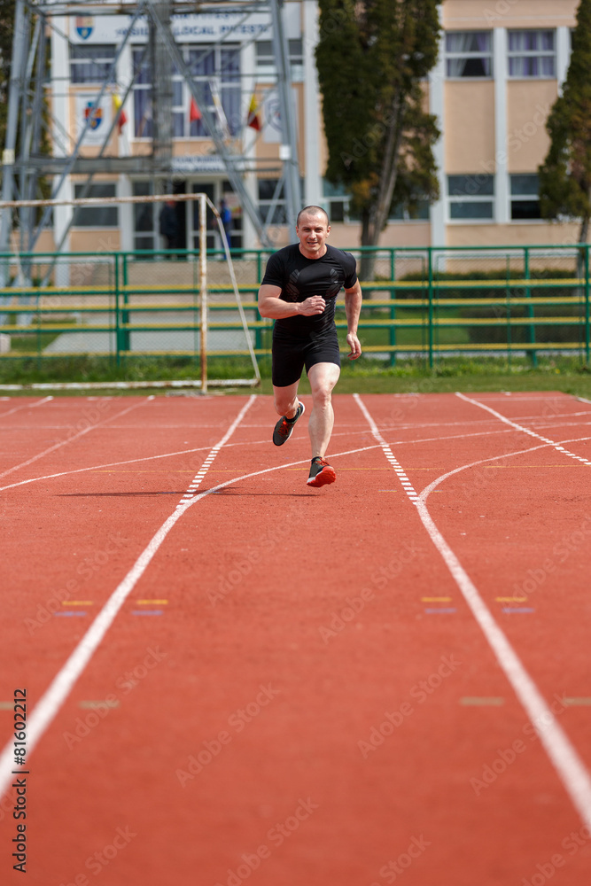 healthy man run on athletics race sport track and representing c