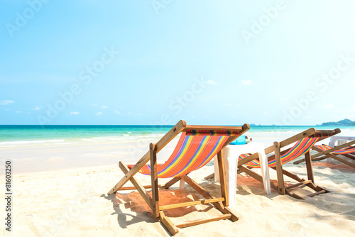 Beach chairs on idyllic tropical sand beach