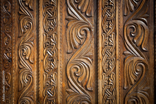 Abstract floral decoration carved on a wood door