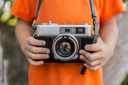 boy with old camera retro