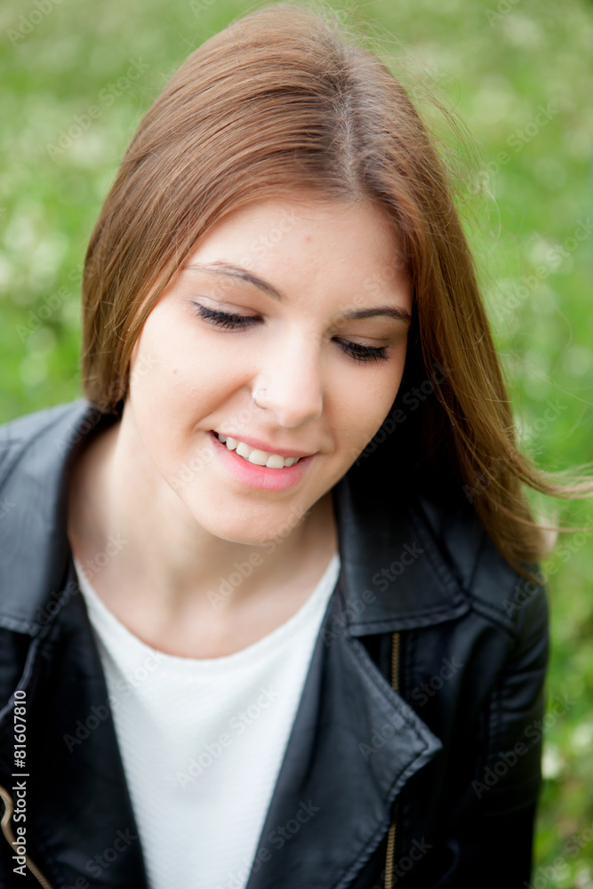 Pensive pretty woman relaxed at the park Pensive pretty woman relaxed at the park