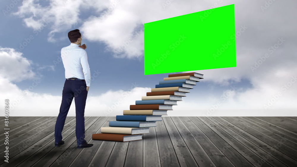 Businessman looking at green screen on a wood ground Businessman looking at green screen on a wood ground