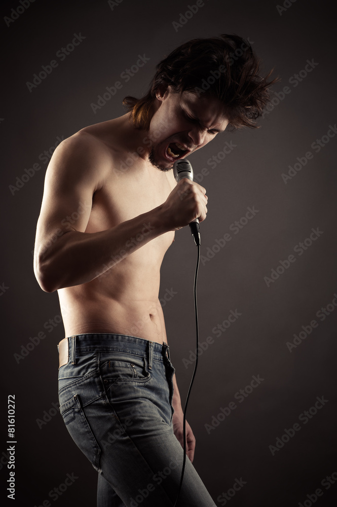 man singing into a microphone