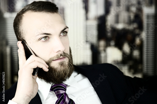 Serious handsome business man on the phone