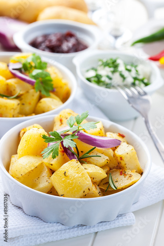 Baked potatoes with chutney and sour cream