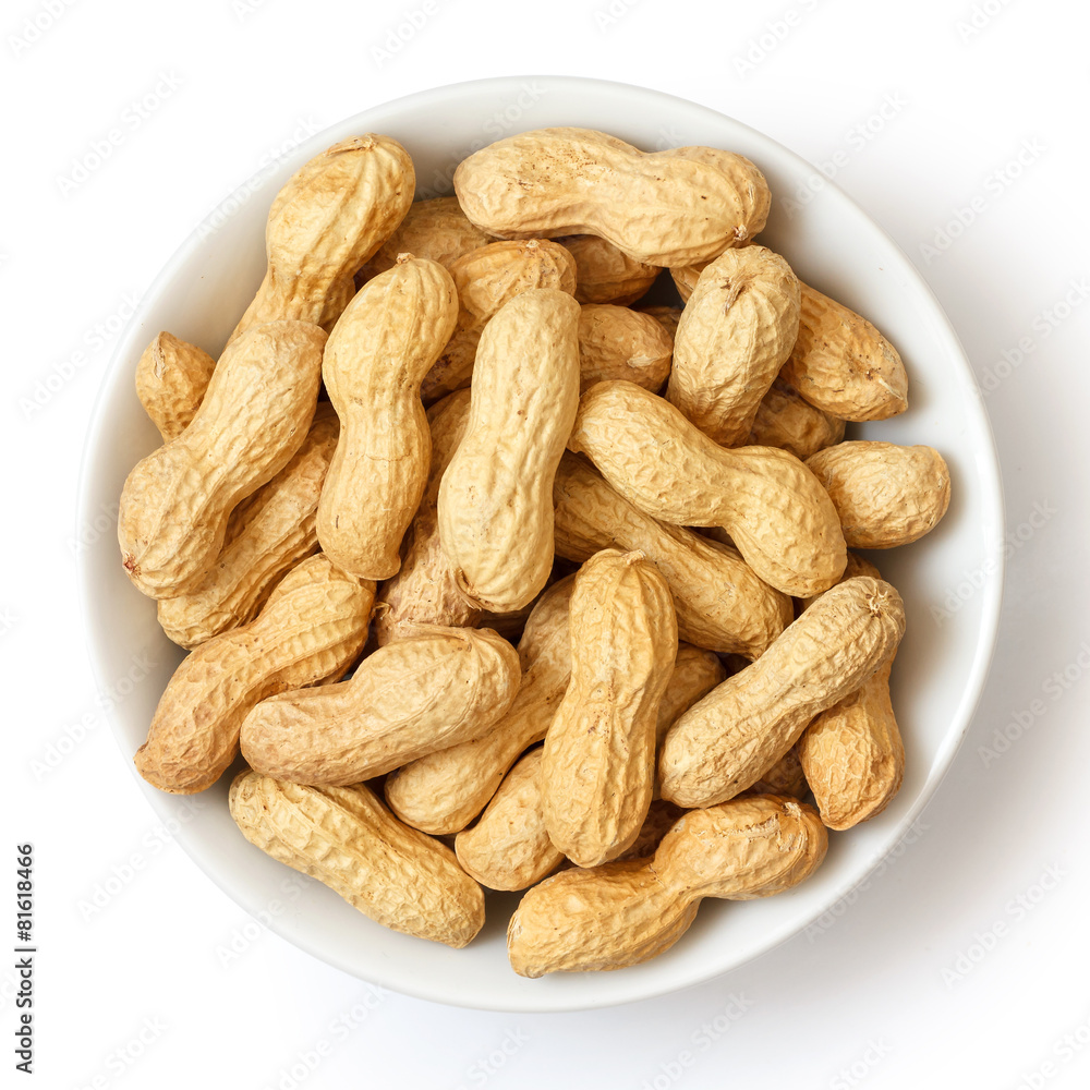 Round ceramic bowl of peanuts in shells. From above. Round ceramic bowl of peanuts in shells. From above.