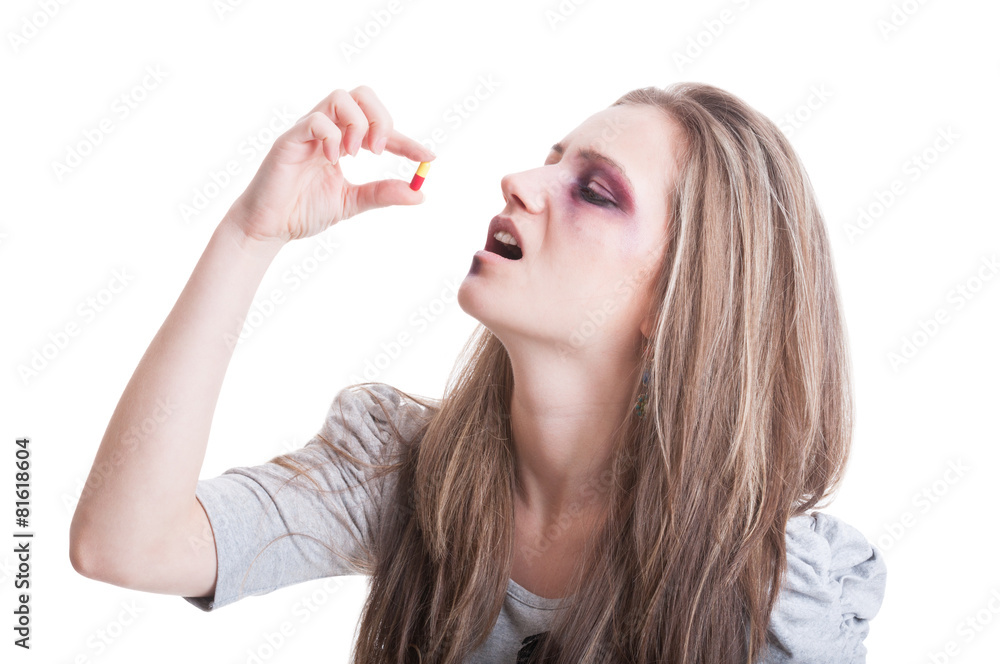 Abused, beaten and injured woman taking antibiotics