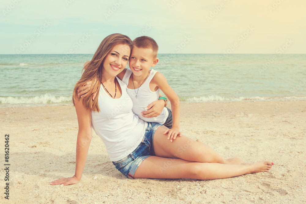 Mother and her son having fun on the beach Mother and her son having fun on the beach