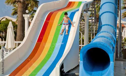 The boy is have fun in the aqua park photo