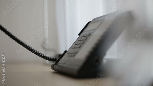 Phone in a hotel room or office. Close up
