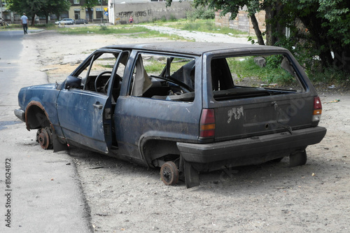 The broken car on the side of the road in poland