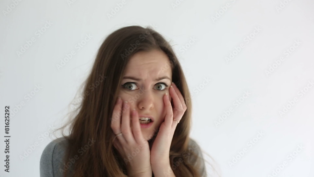 Young woman shows feelings and emotions on the face. Close up Young woman shows feelings and emotions on the face. Close up