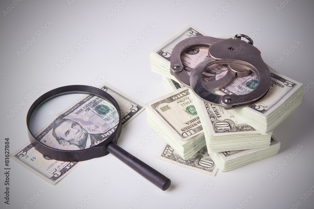 Pack of dollars with magnifier and handcuffs Pack of dollars with magnifier and handcuffs