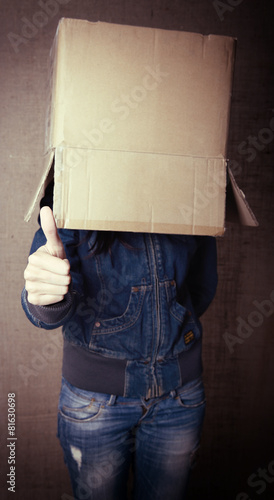 faceless girl with box on her head LIKE with thumb up, social ne photo