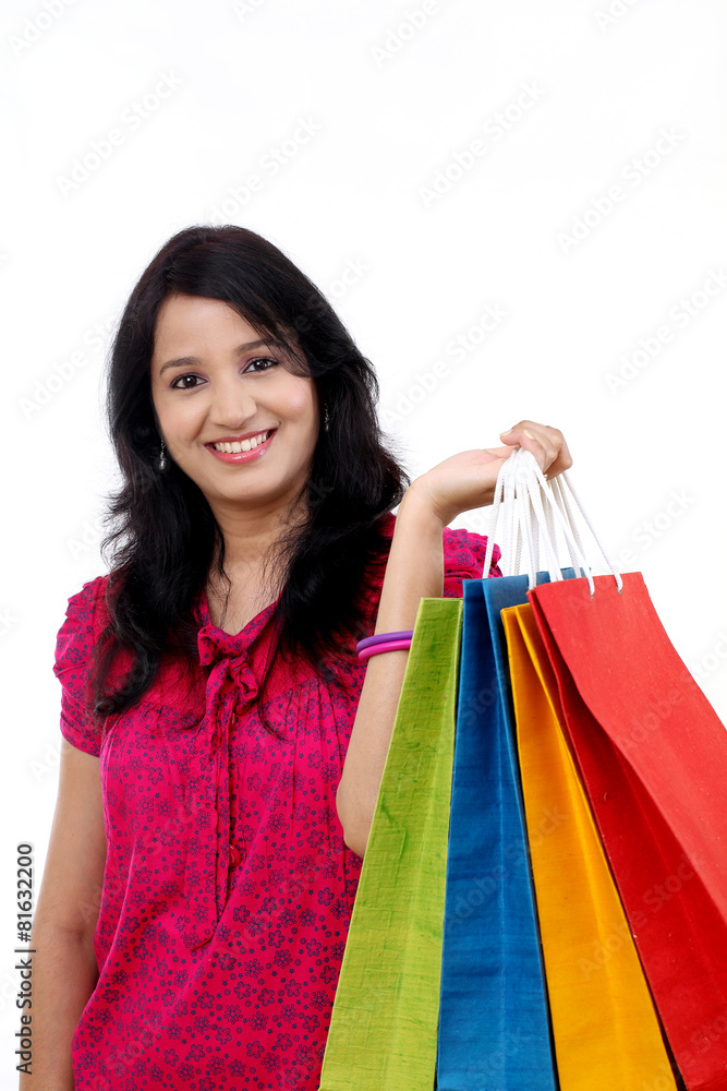 Young happy smiling woman with shopping bags