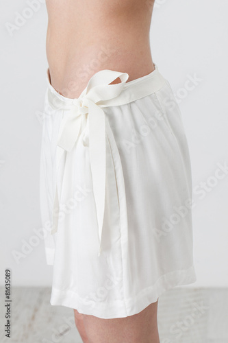 Woman in white shorts