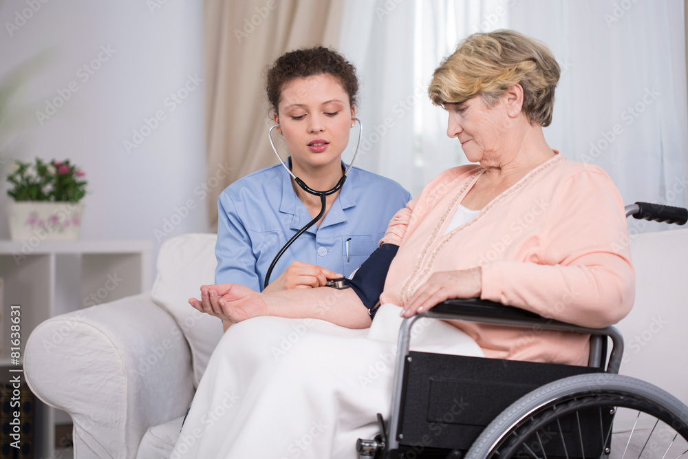 Nurse measuring blood pressure Nurse measuring blood pressure
