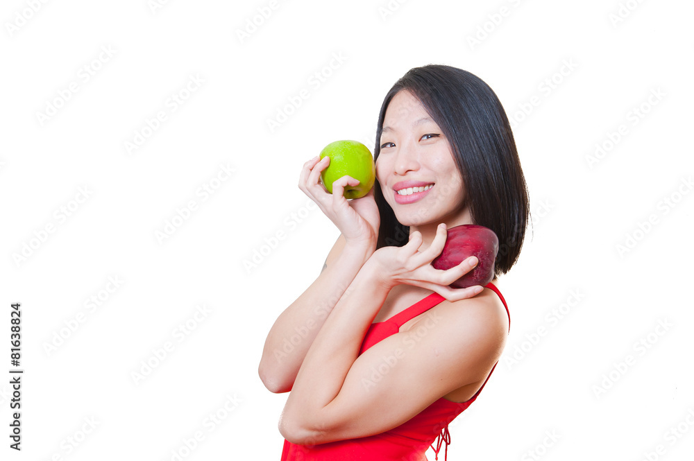 Young smiling asian woman red dress with apples on hands Young smiling asian woman red dress with apples on hands