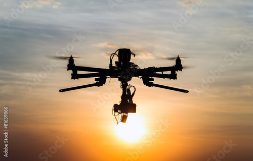 Drone flying in the sunset